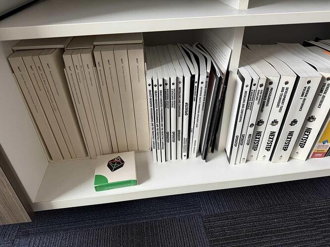A shelf in my office, with a bunch of now-ancient NeXT manuals.